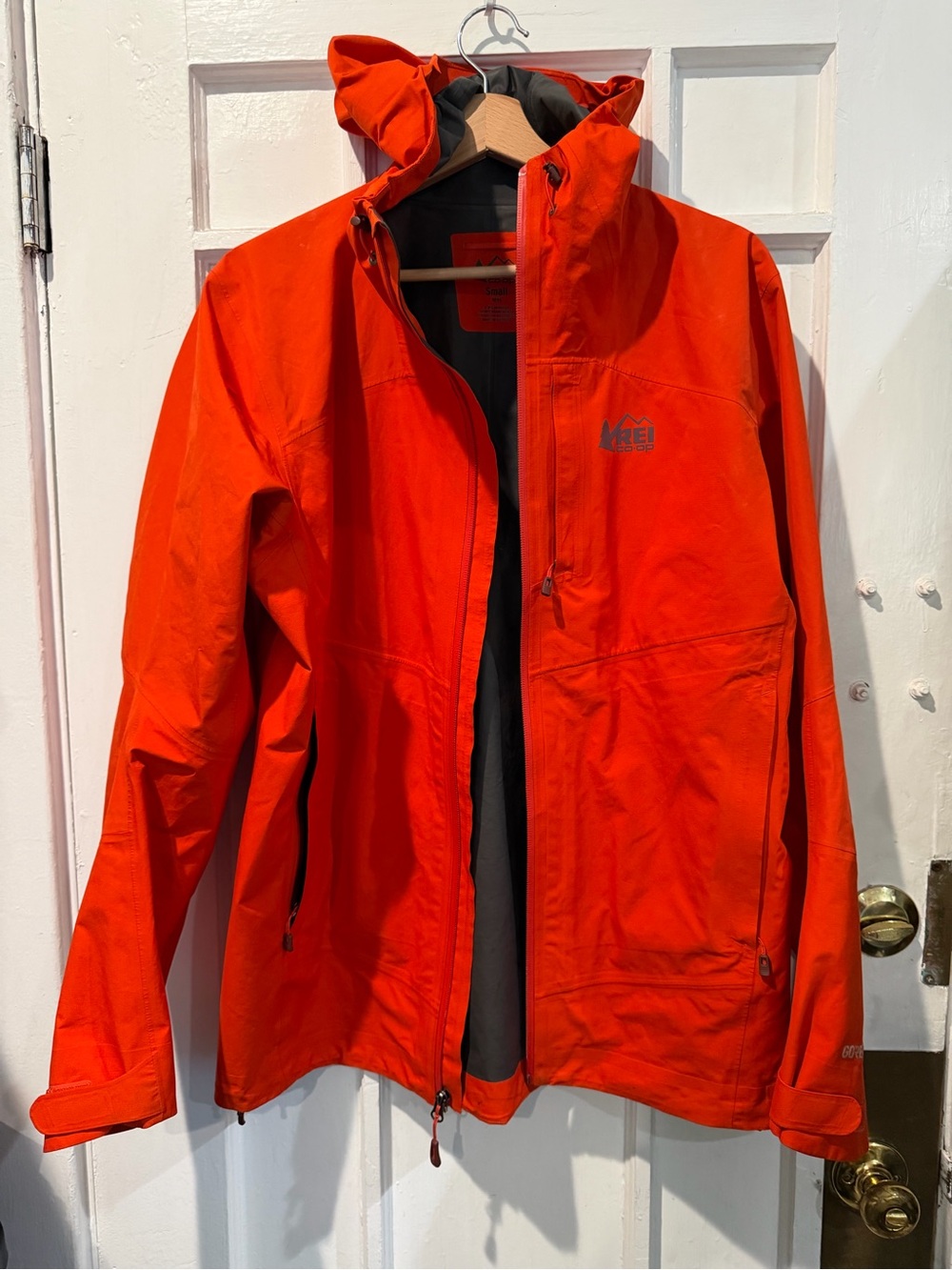 REI Men’s Hooded Rain Jacket in Bright Orange